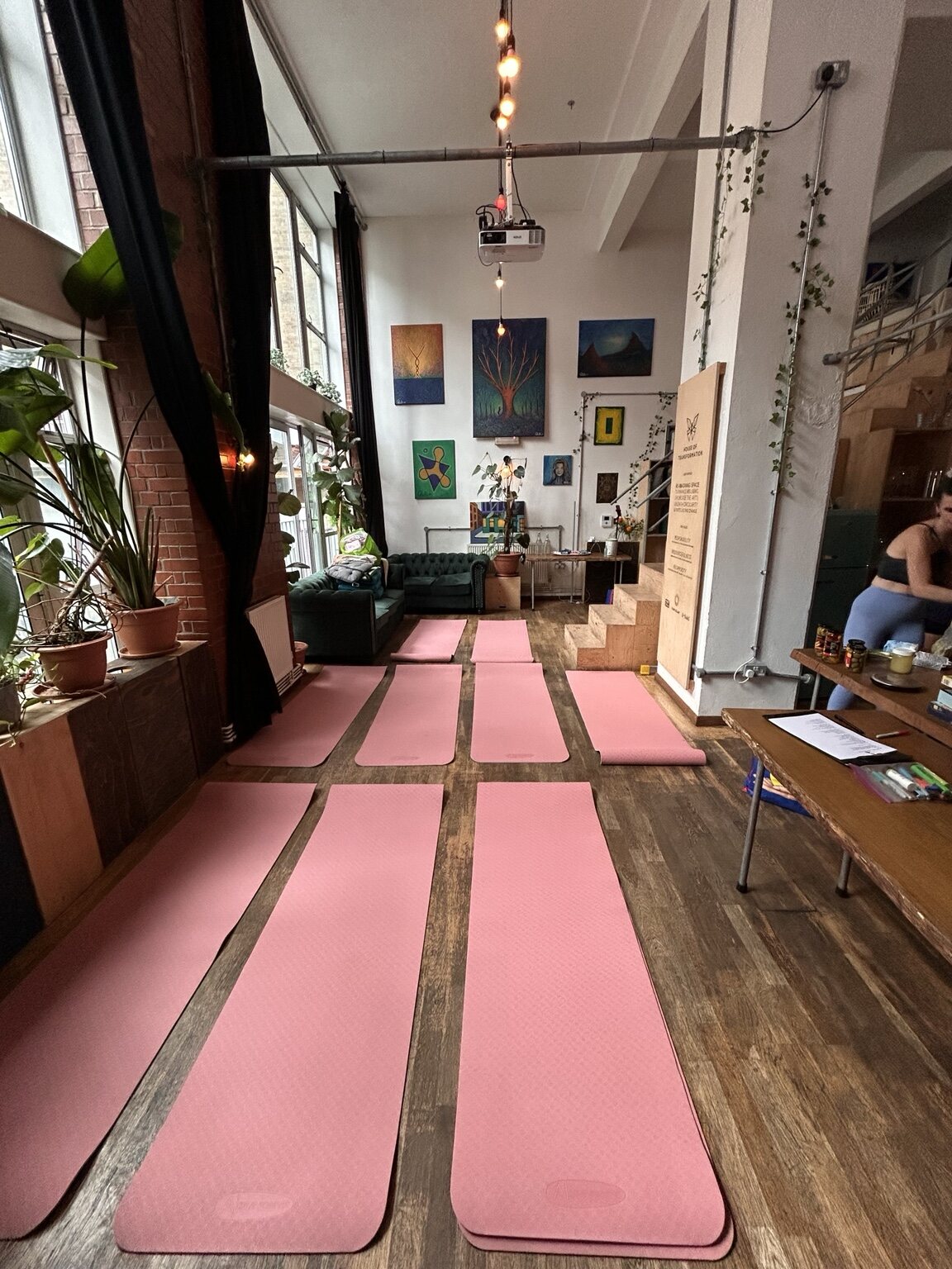 Pink yoga mats prepared in the Girly Wine Night retreat space