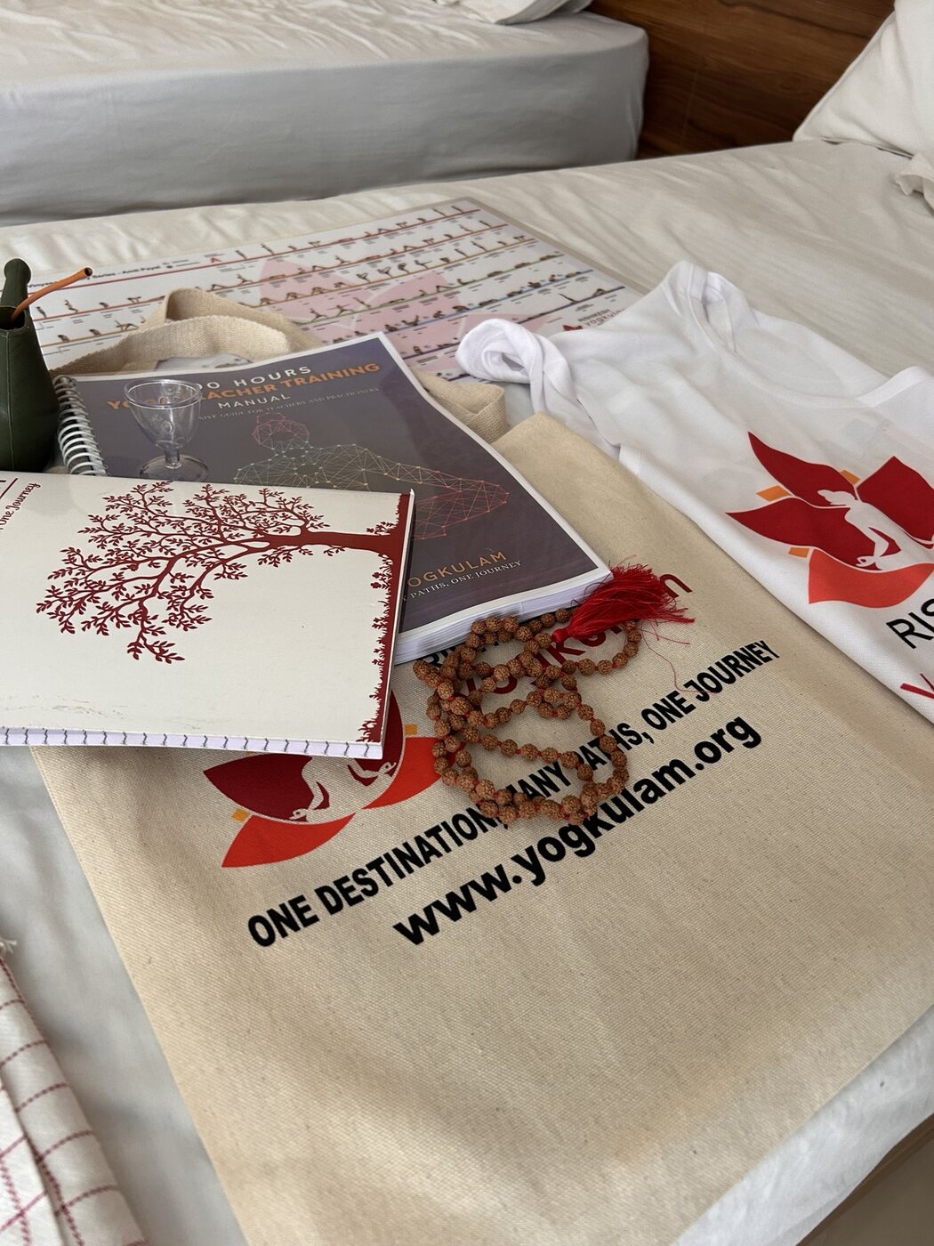 Yoga teacher training manuals, a mala and course materials