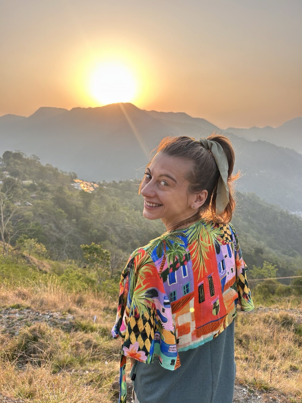 Vanessa smiling at sunrise in the hills around Rishikesh