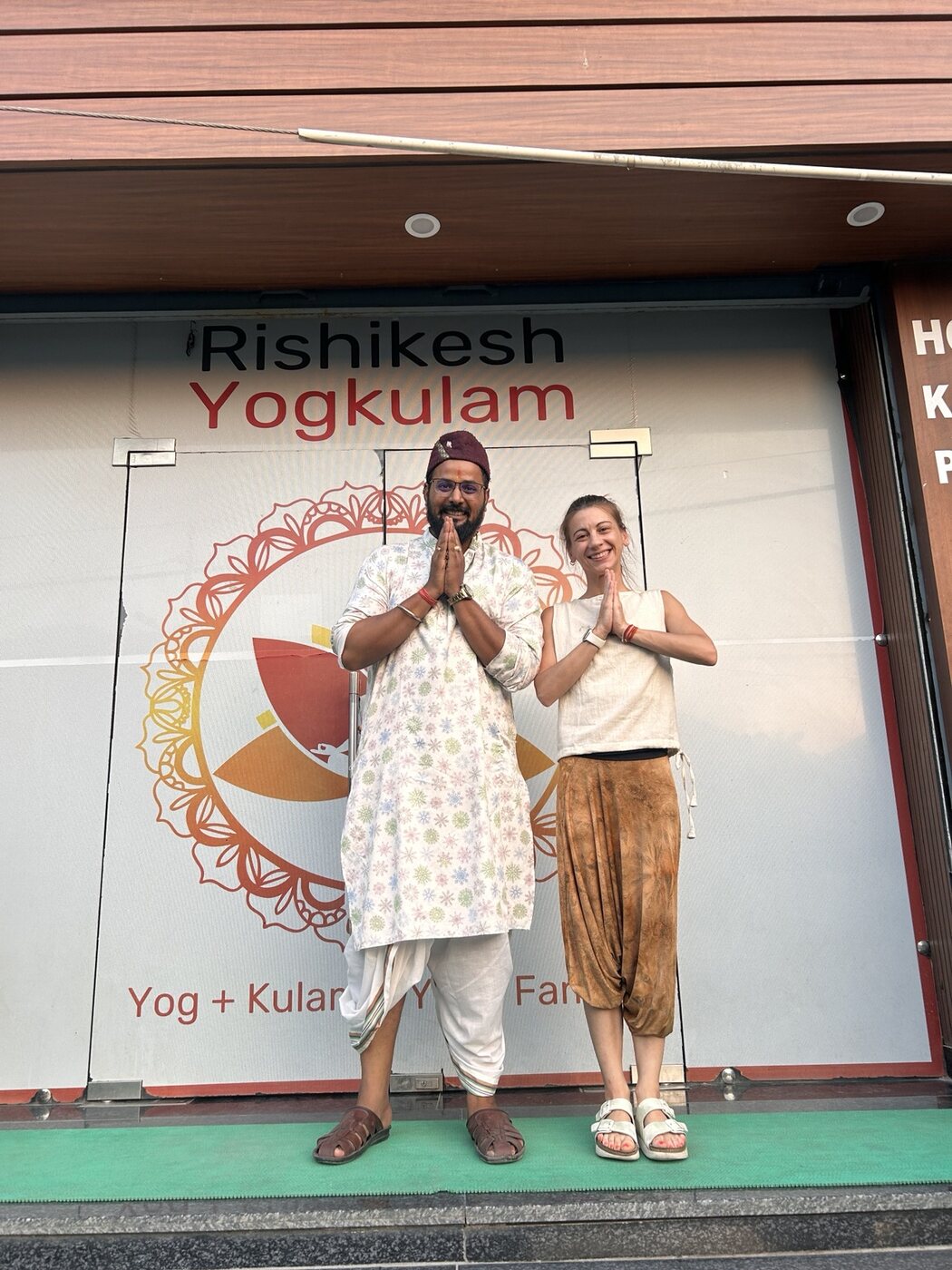 Vanessa with her meditation teacher outside Rishikesh Yogkulam